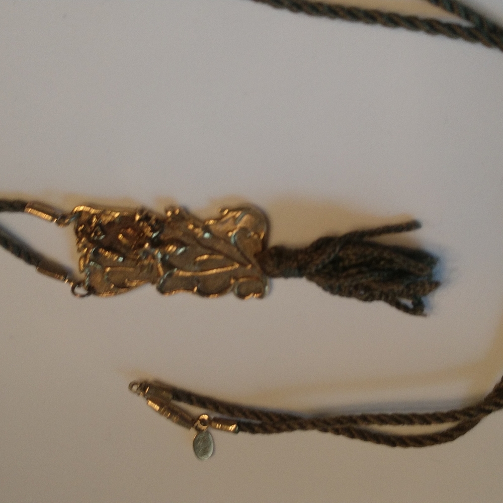 Vintage Iberia tasseled pendant on green cord
